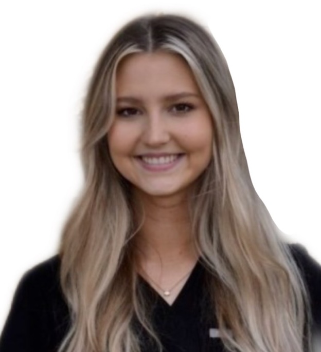 A smiling woman in a black scrub shirt.